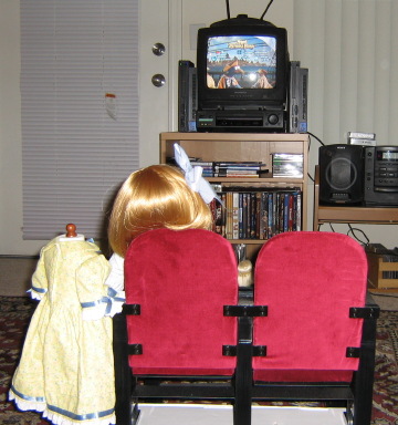Back view of said scene, looking onto a TV with the DVD menu of Muppet Treasure Island