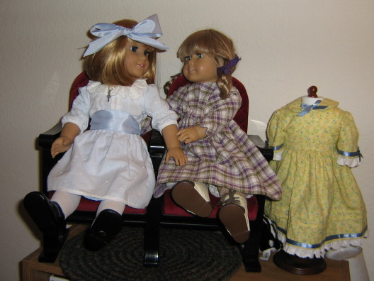 Nellie and Kirsten sit on the theater seats with Pegleg Sally nearby. Kirsten comforts Nellie.
